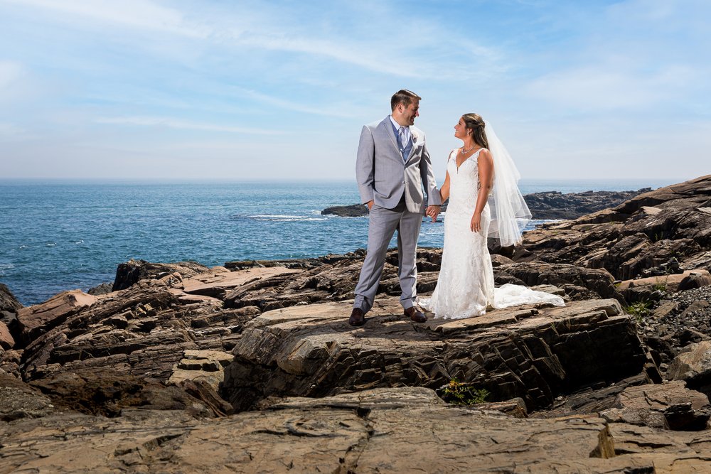 bride-groom-wedding-portrait-on-rocks-at-cliff-house-maine.jpg