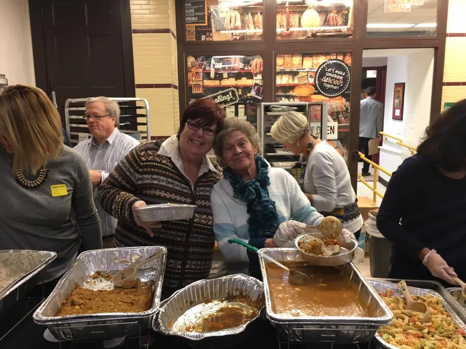 Nancy and Sue helping serve at the annual Thanksgiving Dinner for all the students and families of St. James School
