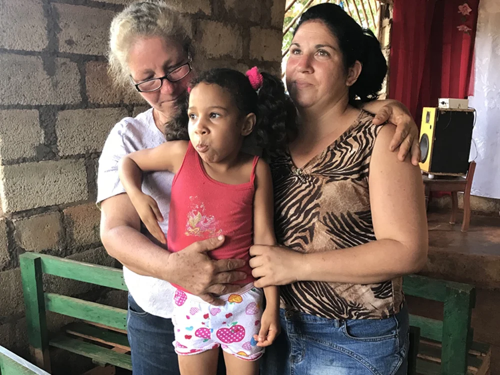 Maribel (left inside her church.jpg