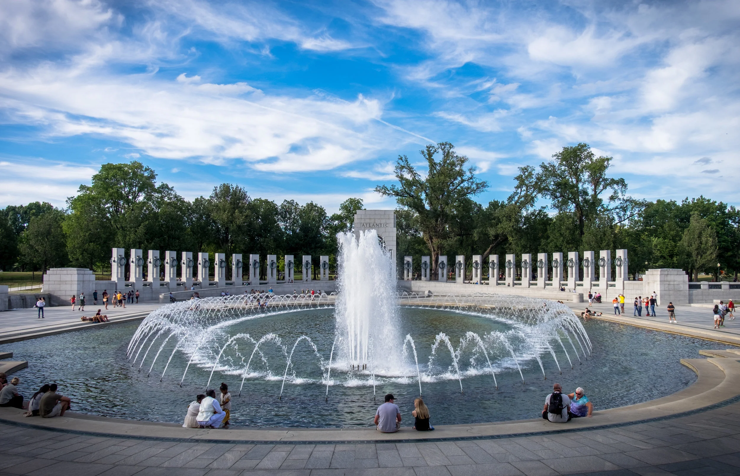 This is looking toward the Pacific theater side of the mirrored memorial and is taken from the Atlantic side. Battles are etched in the granite and there are two towers, one on each end with striking sculptures inside. 