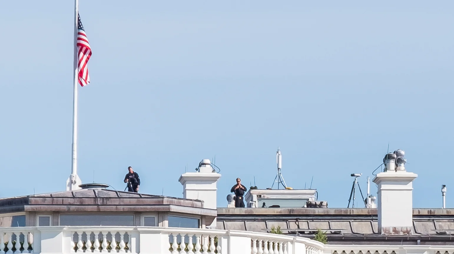 There were at least four people on the roof with rifles and scopes