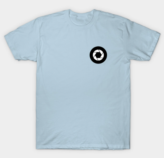 The design on the front of the shirt is the tire/ camera aperture that is the wheel in our TLT logo.