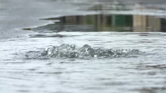 flood-water-escaping-from-drain-cover-in-slow-motion_4ybakcok__M0000.jpg