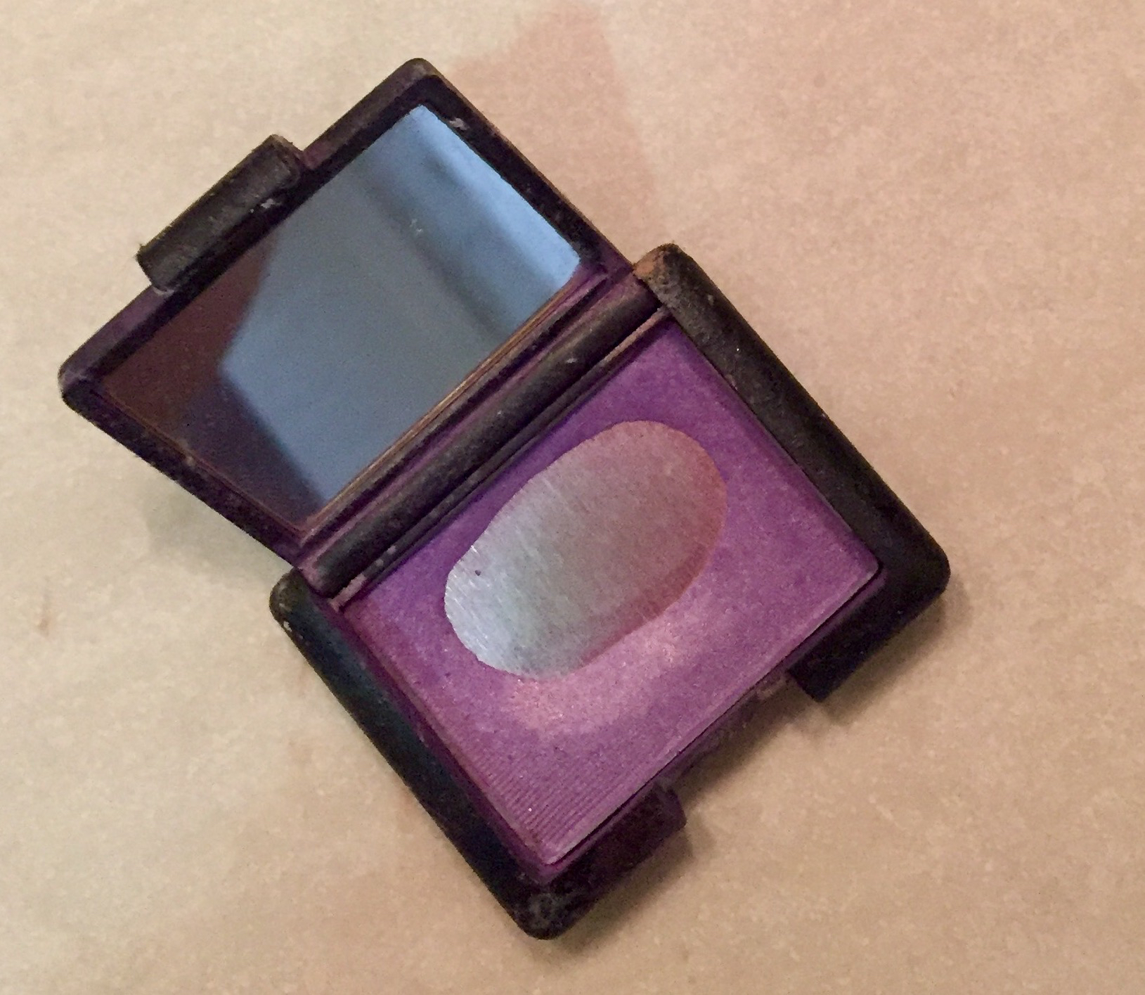 I can't recall where or when I bought this eyeshadow, but shortly after taking the picture, I threw it out.