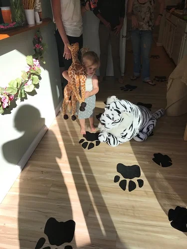 Roman's buddy, Emmy, shows off some of our jungle decor and paw prints