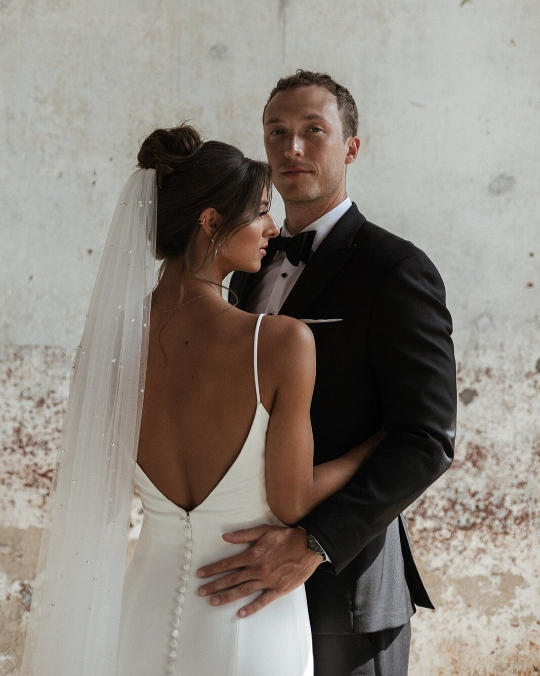 Where elegance meets eternal love. Celebrating a union that is as timeless as the gown itself ✨. Congrats to Jenna and Luke!⁣
Venue: @theprovidencecottonmill 
Photography: @nikkibakerphotography 
Coordinator: @kevstone.event 
Florals: @traderjoes 
Ha