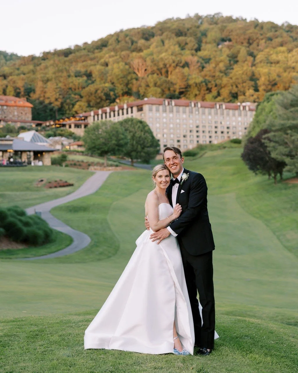 With the majestic Blue Ridge Mountains rolling in the distance and the historic elegance of the Omni Grove Park Inn surrounding them, Caroline and Tyler said &ldquo;I do&rdquo; in a setting straight out of a dream. Caroline was the picture of timeles