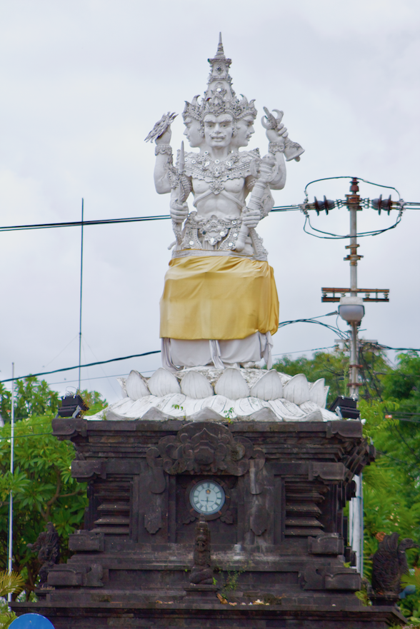 Four Faces Statue