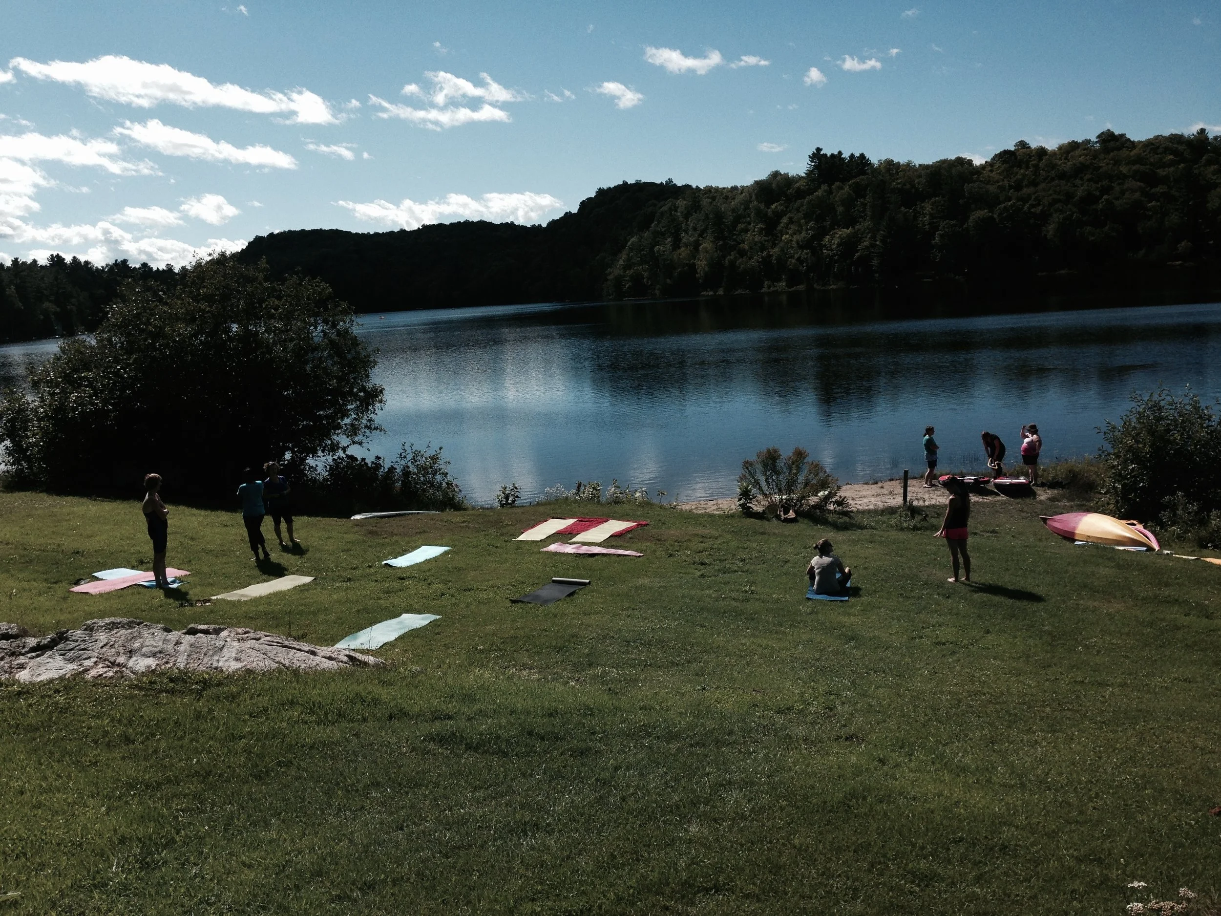 Yoga class by the water's edge