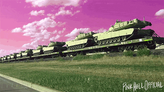 Video loop of tanks being transported by train with a pink sky