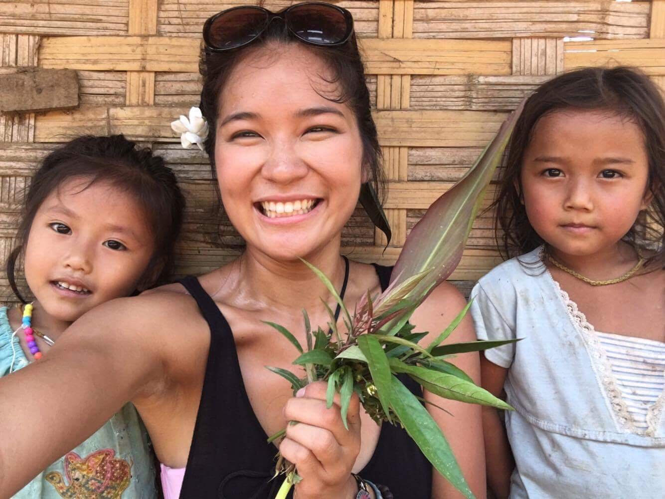 Denise and village girls being perfect. They kept handing her flowers and plants to add to her bouquet.