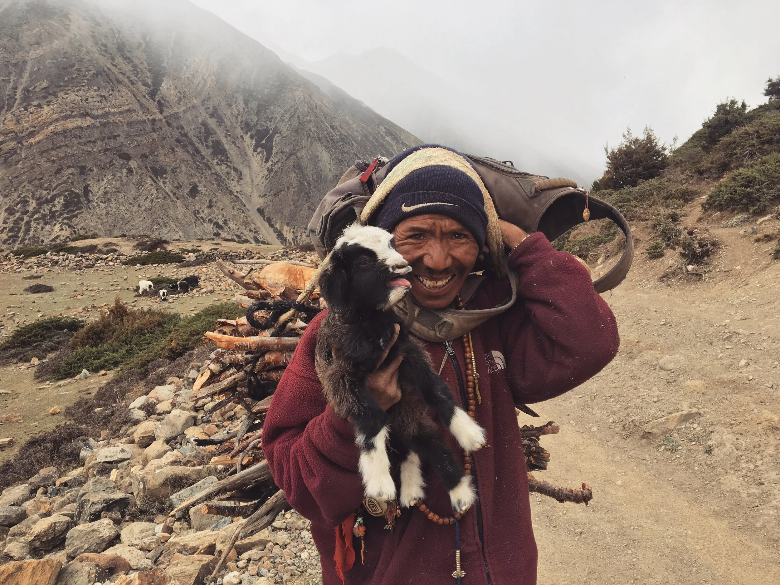 Happiest man and a screaming baby goat.