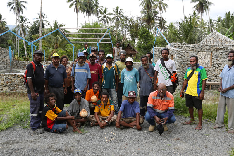 Some of the Timini villagers standing in front of the church building.