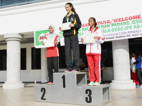 Collecting her bronze medal.