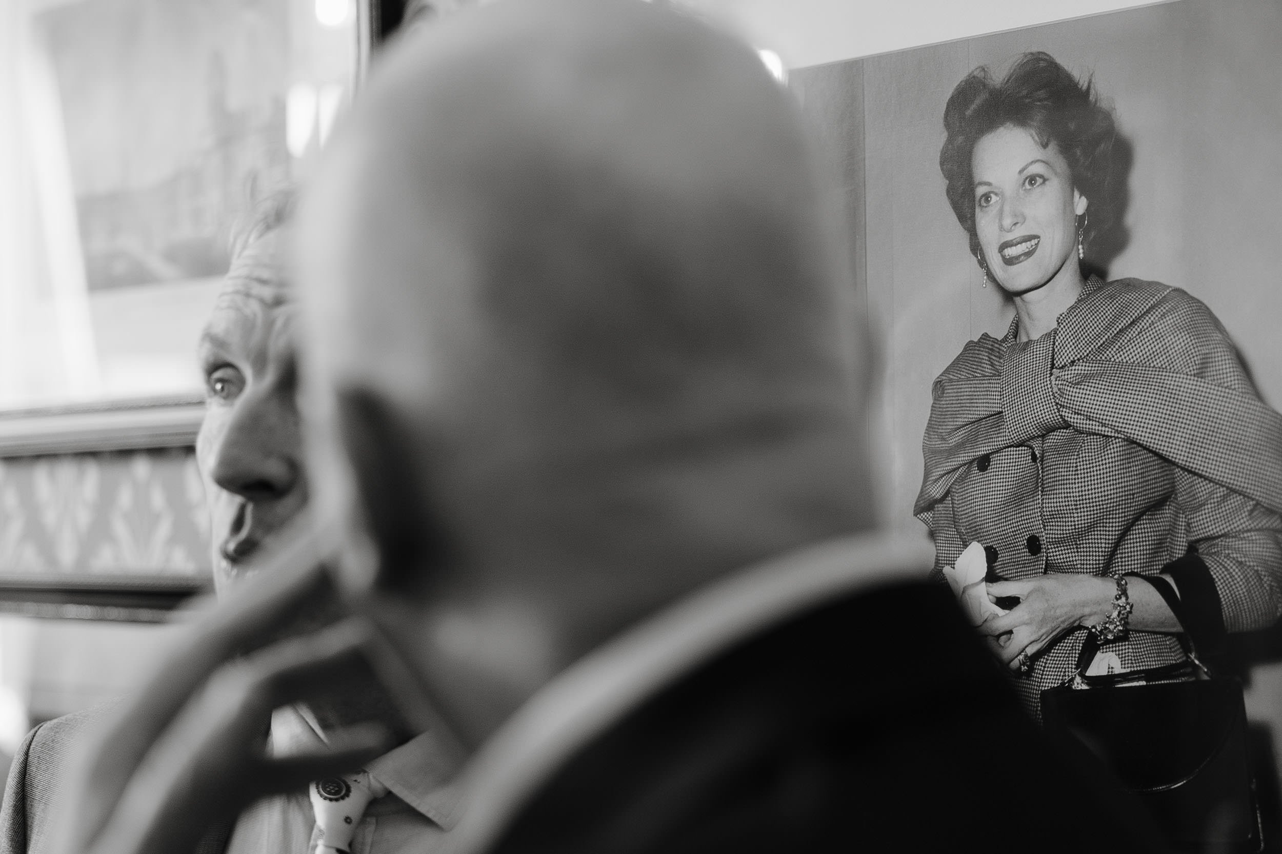 interesting perspective of wedding guests in a documentary style.