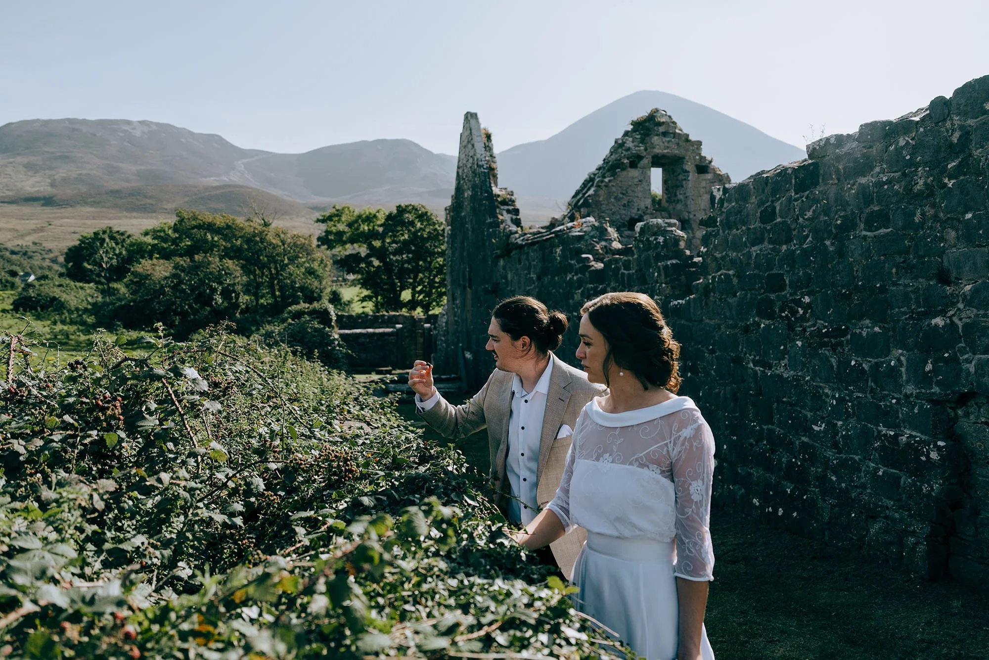 Wedding photographs in the remains of a ruined Abbey along the shores of Clew Bay along the Wild Atlantic Way.