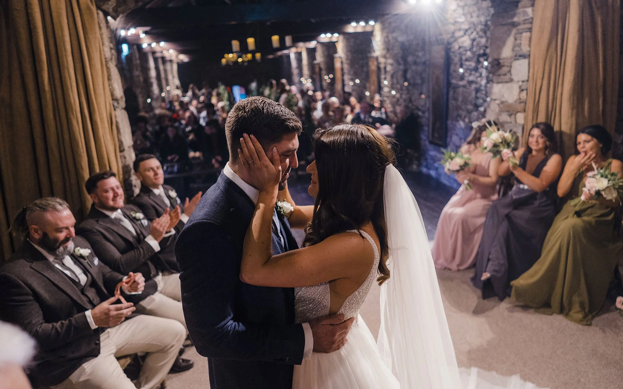 An emotional bride and groom in the ceremony room at Ballybeg House