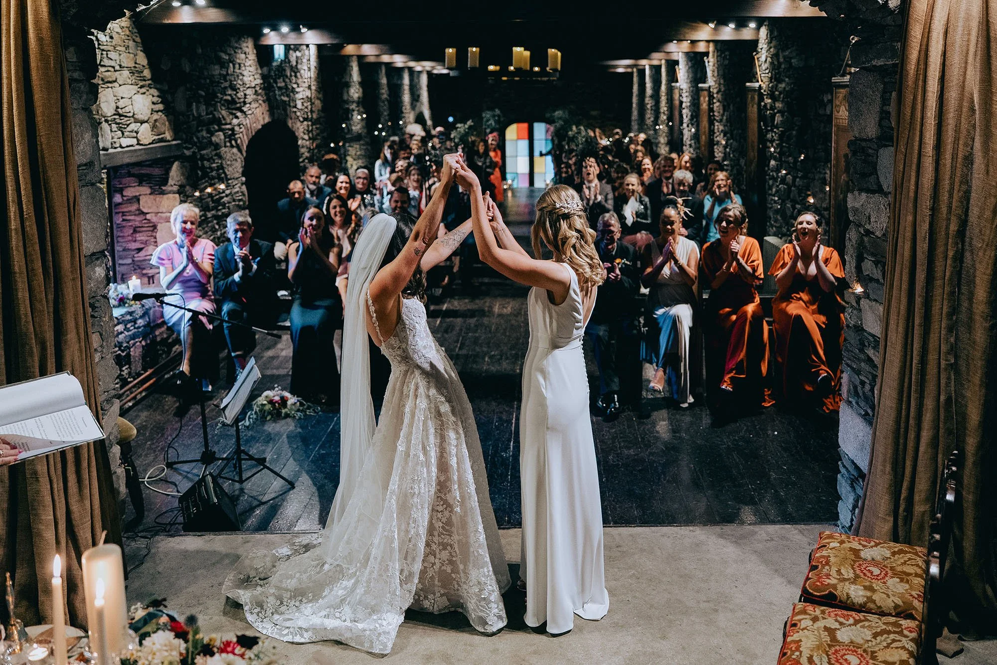 Two brides celebrate their wedding in the ceremony room at Ballybeg House 