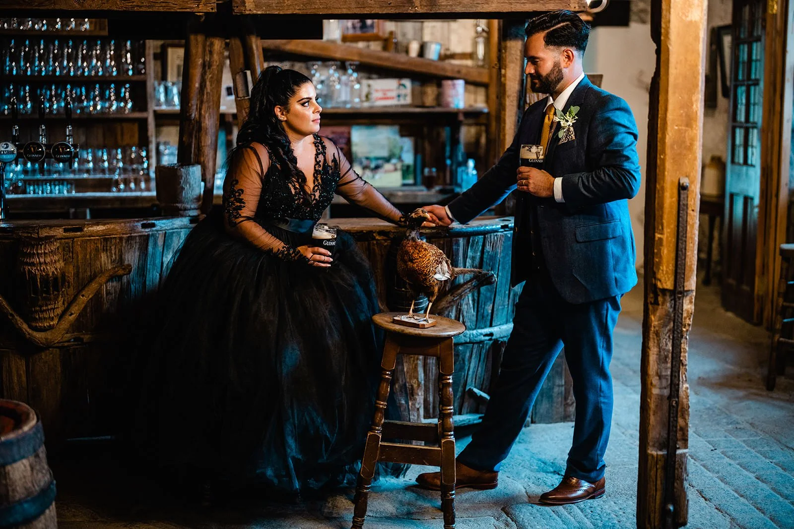 bride and groom drinking guinness in the shebeen bar at Ballybeg house
