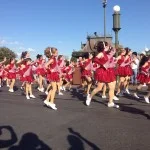 Elite dancers in the afternoon parade at Disney dancing to Jingle Bells.