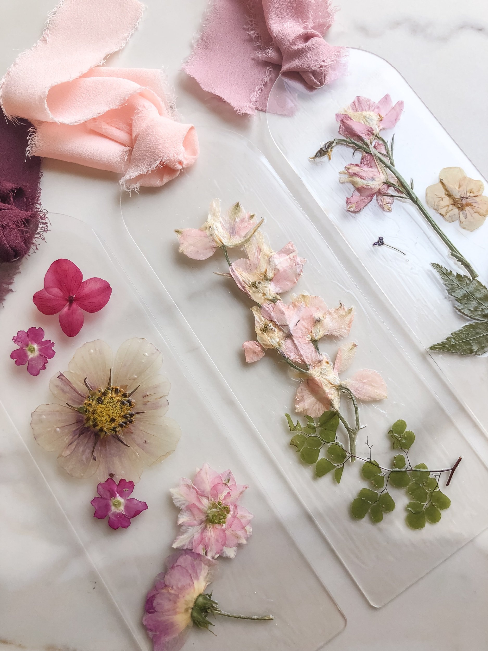 3 - Pink Handmade Acrylic Bookmark with Florals Flowers Botanicals Greenery Feathers and Mushrooms.jpeg