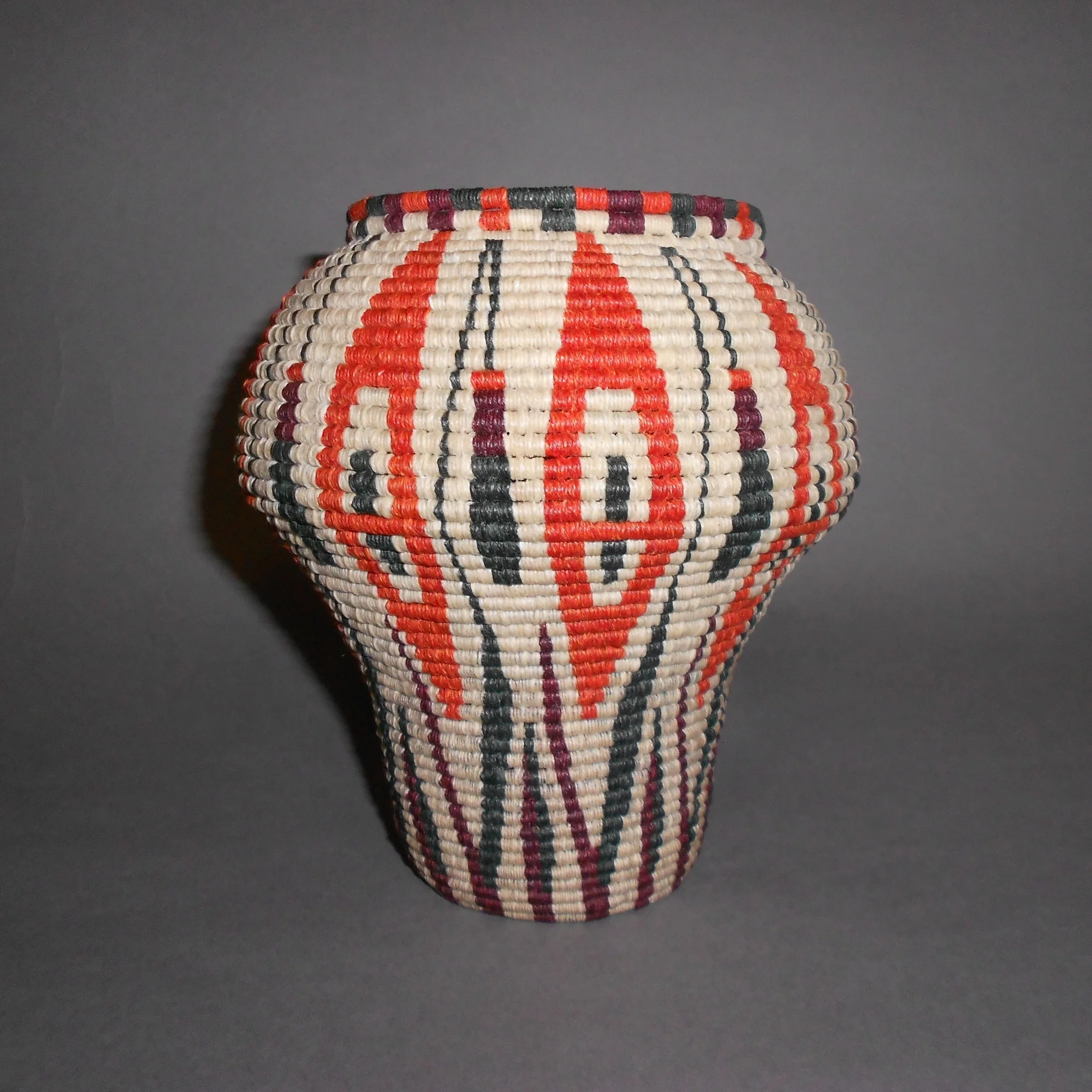  Coiled basket using waxed linen on wire filled paper cord. 