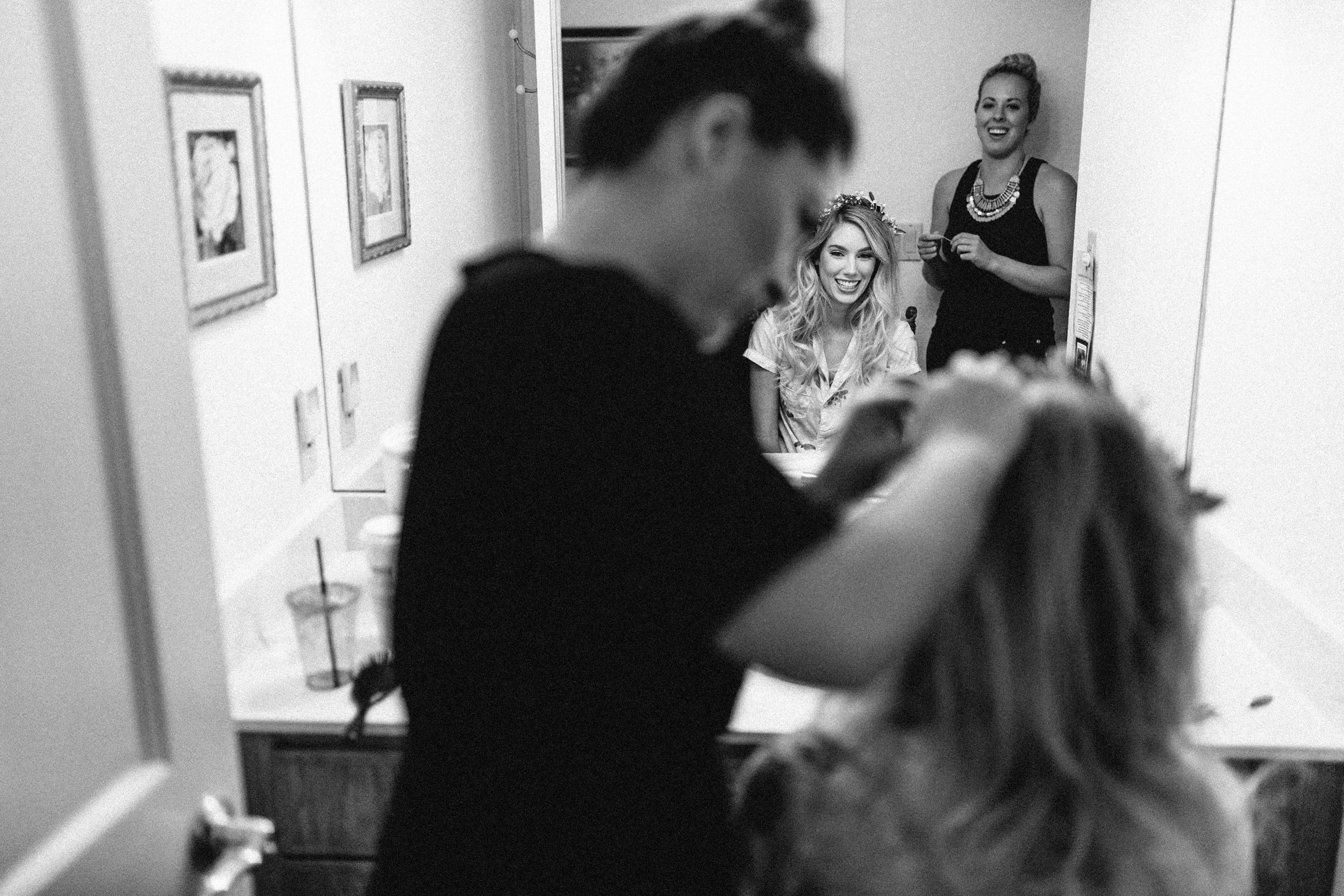 Our artist Jenna placing Hannah's floral crown 