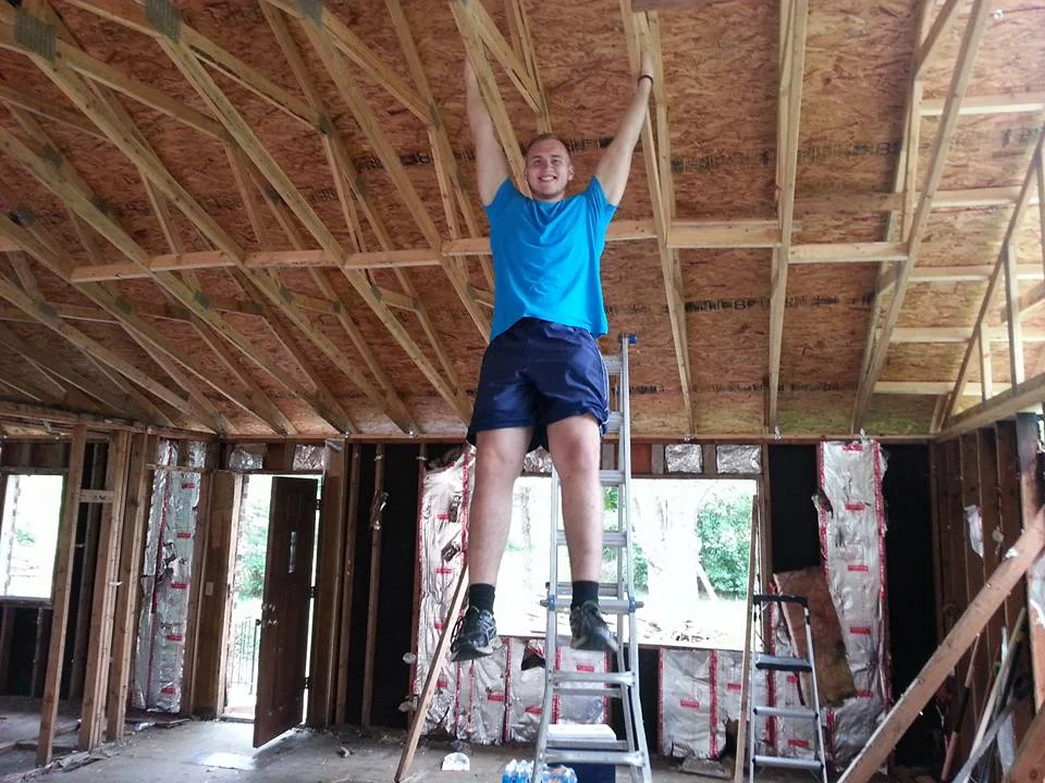 My son Jonah, helping rebuild our house... sorta