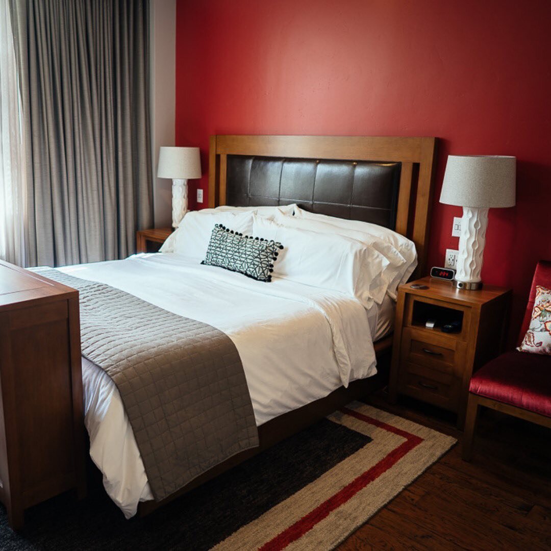 When you travel, what's your style?

Our boutique hotel has four suites, each with its own look! Our Foss Creek Suite features a bold, modern aesthetic distinguished by contrasting red and gray tones.