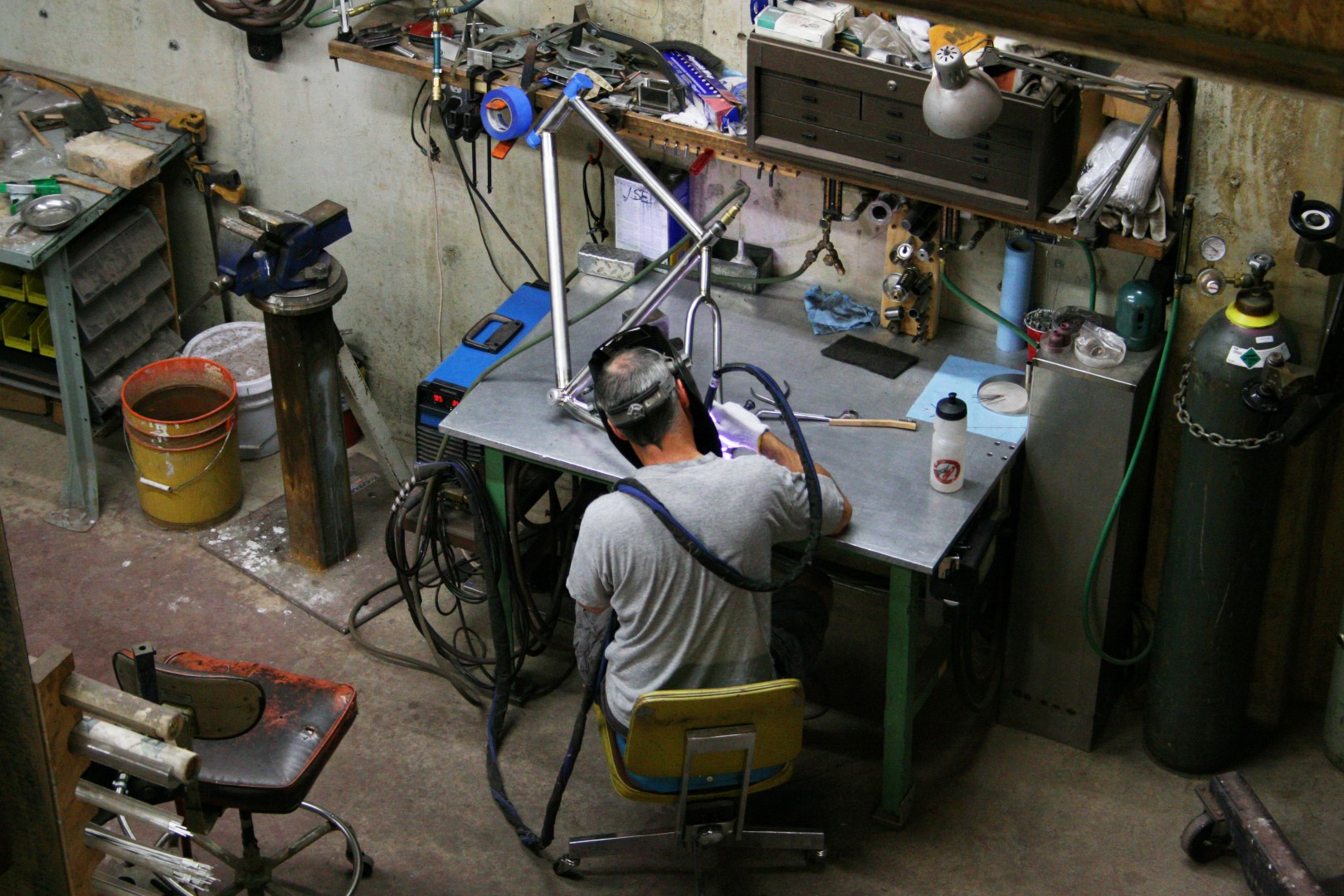 TCF-Shop-Framebuilding-Dave-Welding-Frame-Wide.JPG