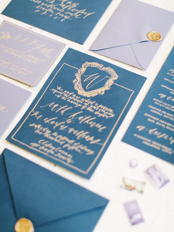 gold-blue-calligraphy-wedding-invitations.png