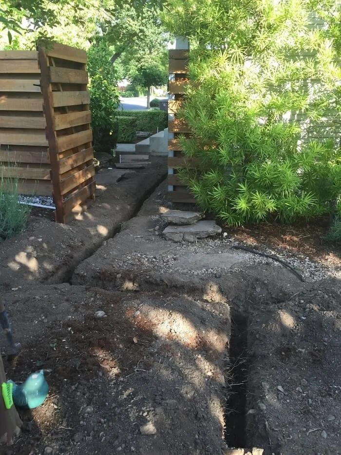Expertly dug trench to allow access for water mainline replacement or repair.