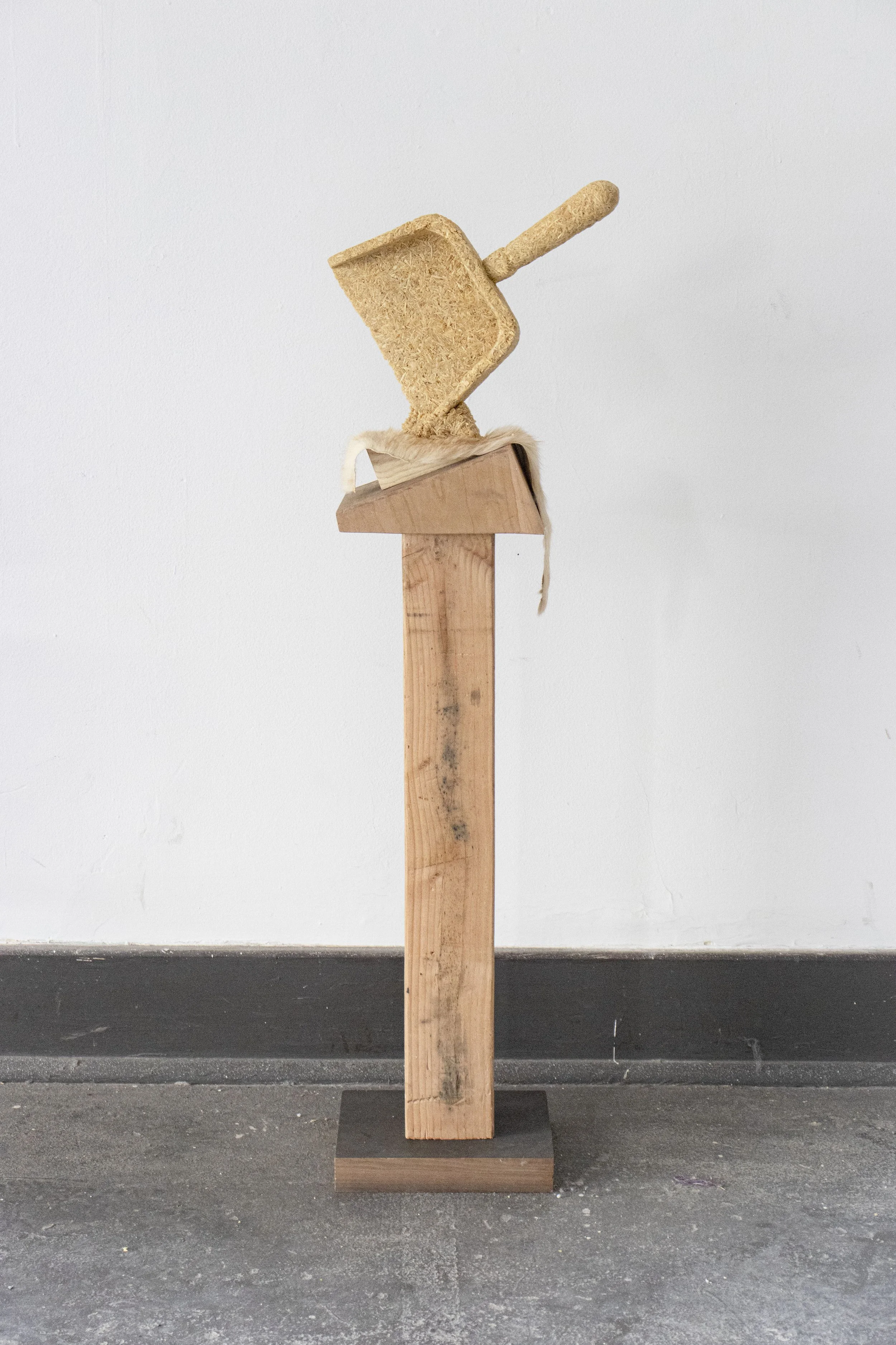  Dawn Dust, 2026,   saw dust, resin, fur, wood scraps,   12” x 8” x 37”  photo by Alissa Touranachun 