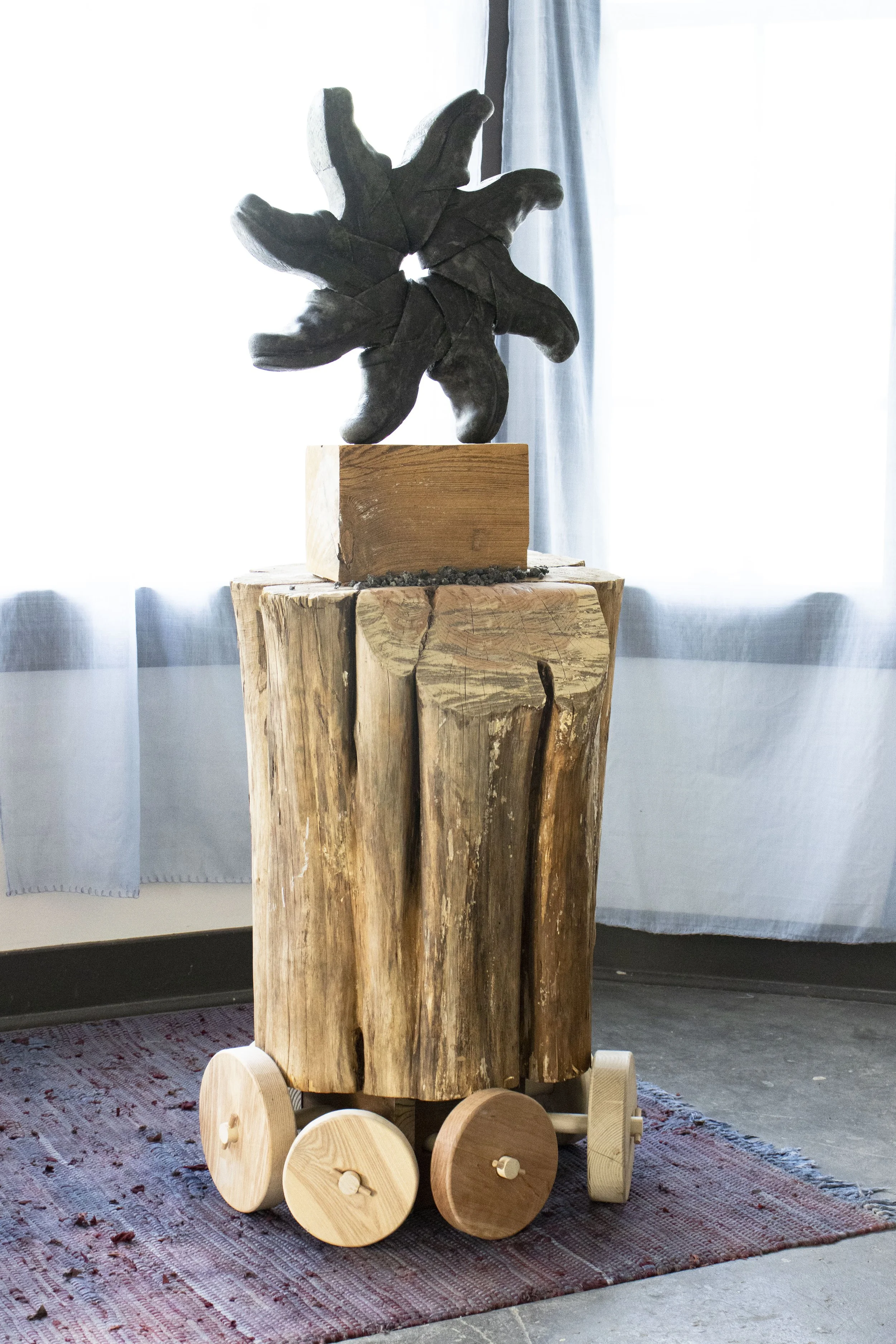  Orientation Machine, 2026,   cast stone, wood,   28” x 30” x 64”  photo by Alissa Touranachun 