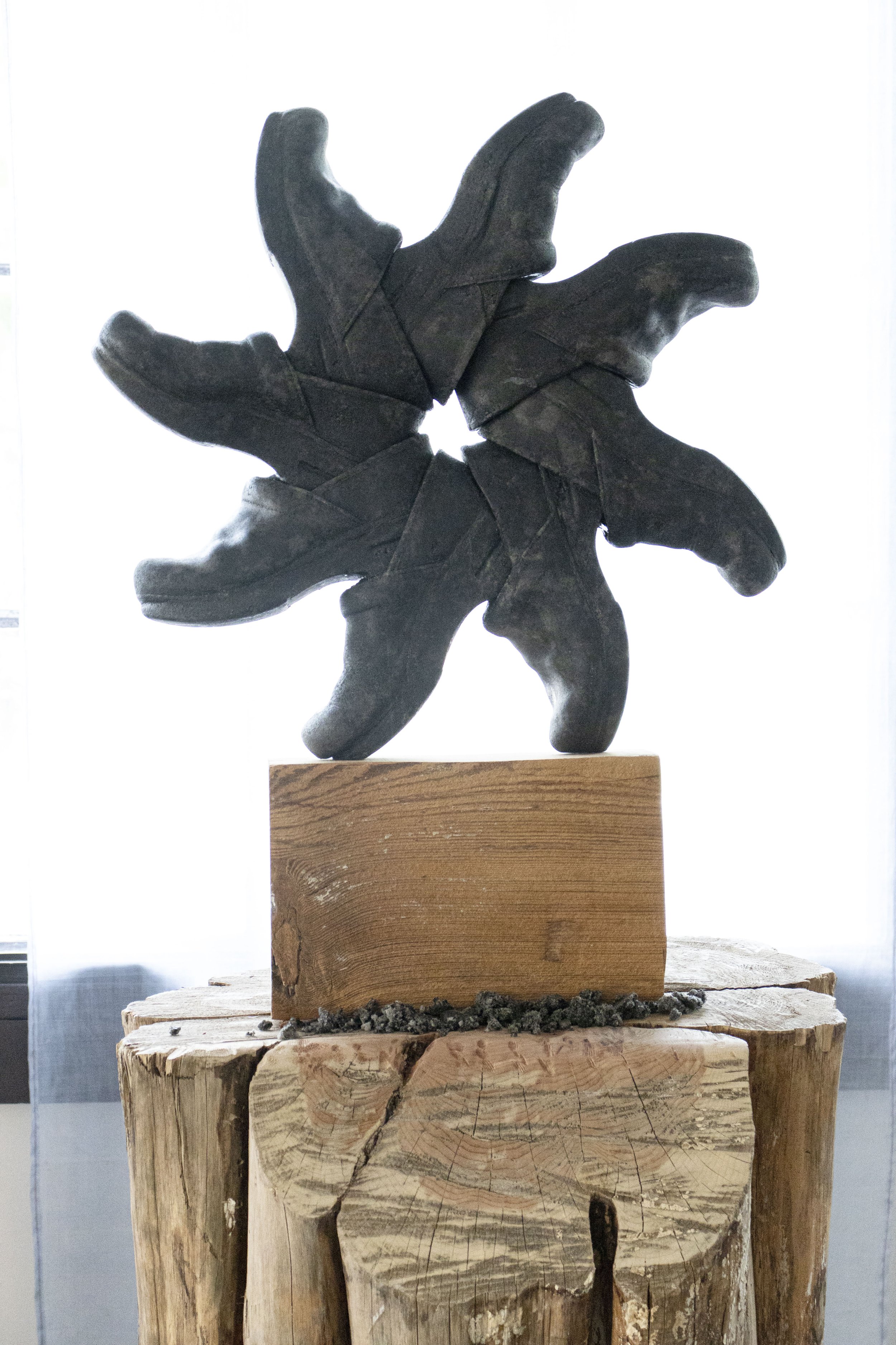  Orientation Machine, 2026,   cast stone, wood,   28” x 30” x 64”  photo by Alissa Touranachun 
