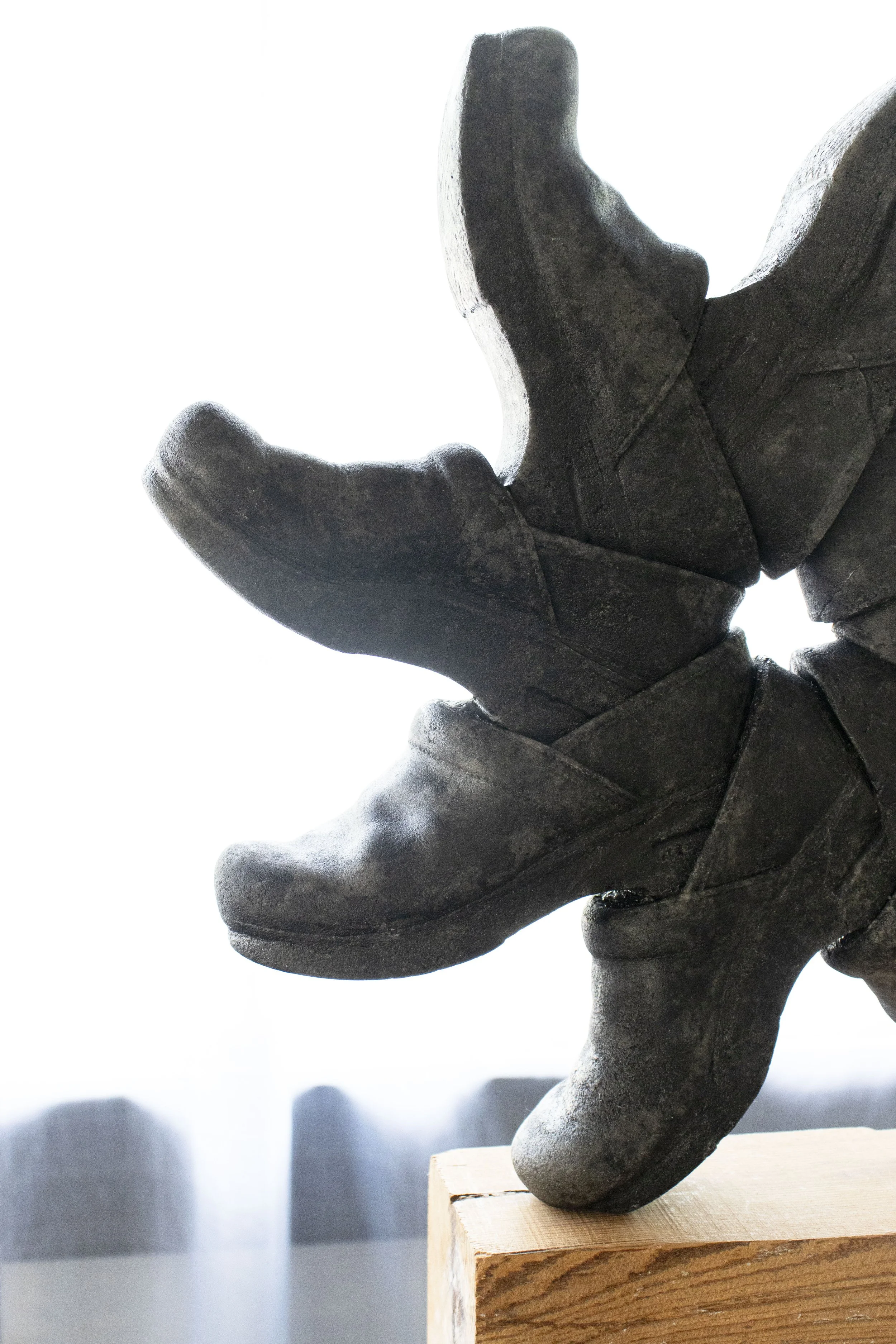  Orientation Machine, 2026,   cast stone, wood,   28” x 30” x 64”  photo by Alissa Touranachun 