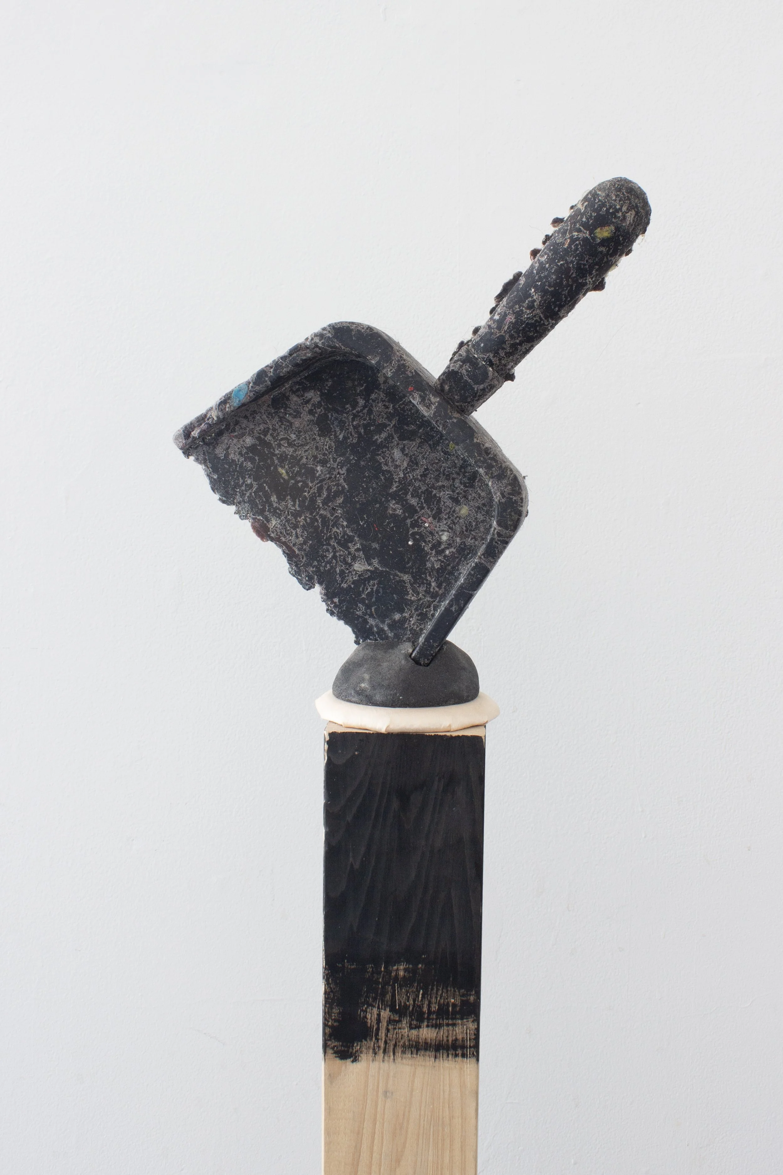  Dust at Dusk, 2026,   dryer lint, cast stone, fabric, wood,   8” x 8” x 54”   