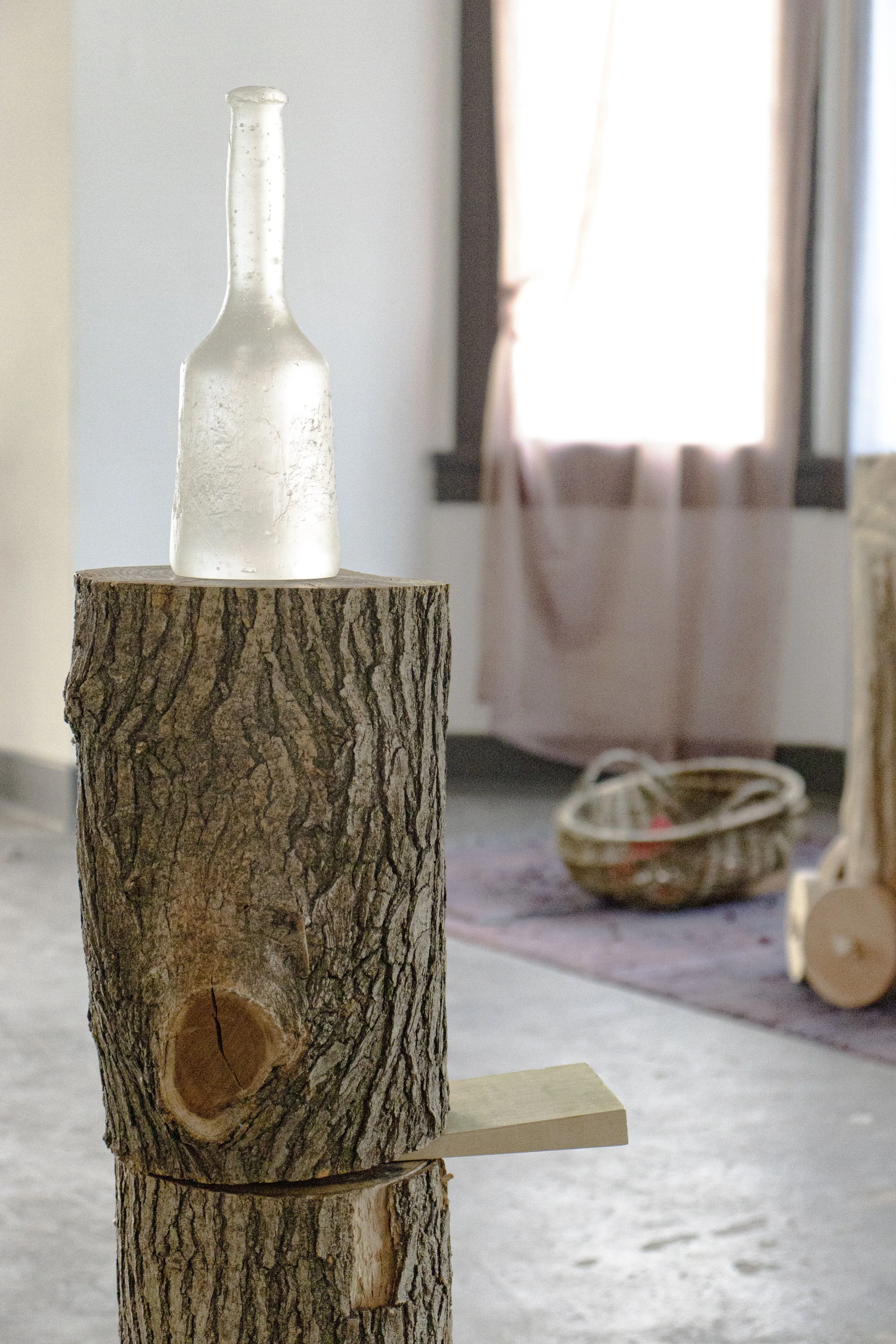  The Tool, 2026,   cast glass, wood,   11” x 10” x 49”  photo by Alissa Touranachun 
