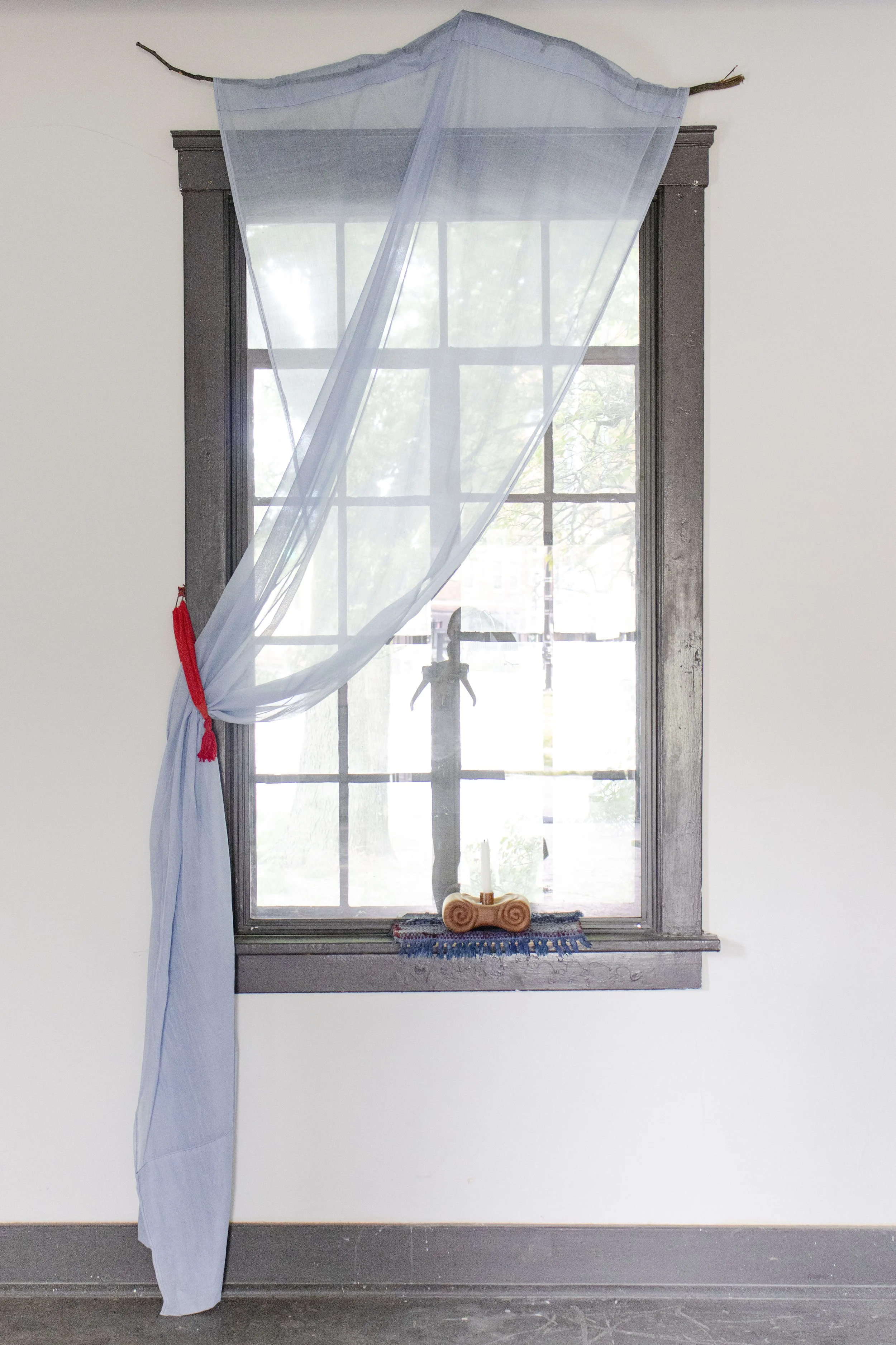  Light Source, 2025,   cherry, cotton rug, dye, candle,   15” x 6” x 14”  photo by Alissa Touranachun 