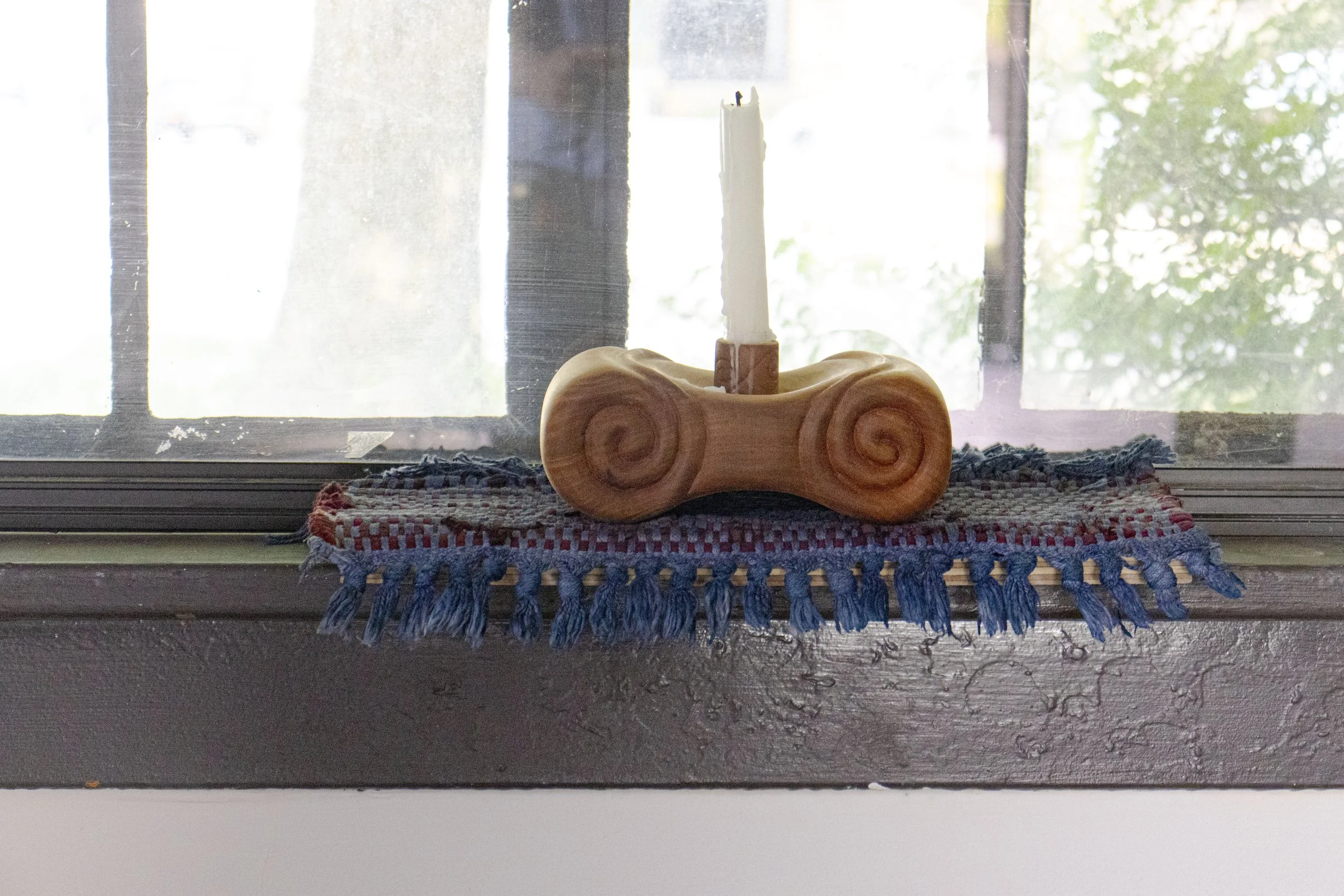  Light Source, 2025,   cherry, cotton rug, dye, candle,   15” x 6” x 14”  photo by Alissa Touranachun 
