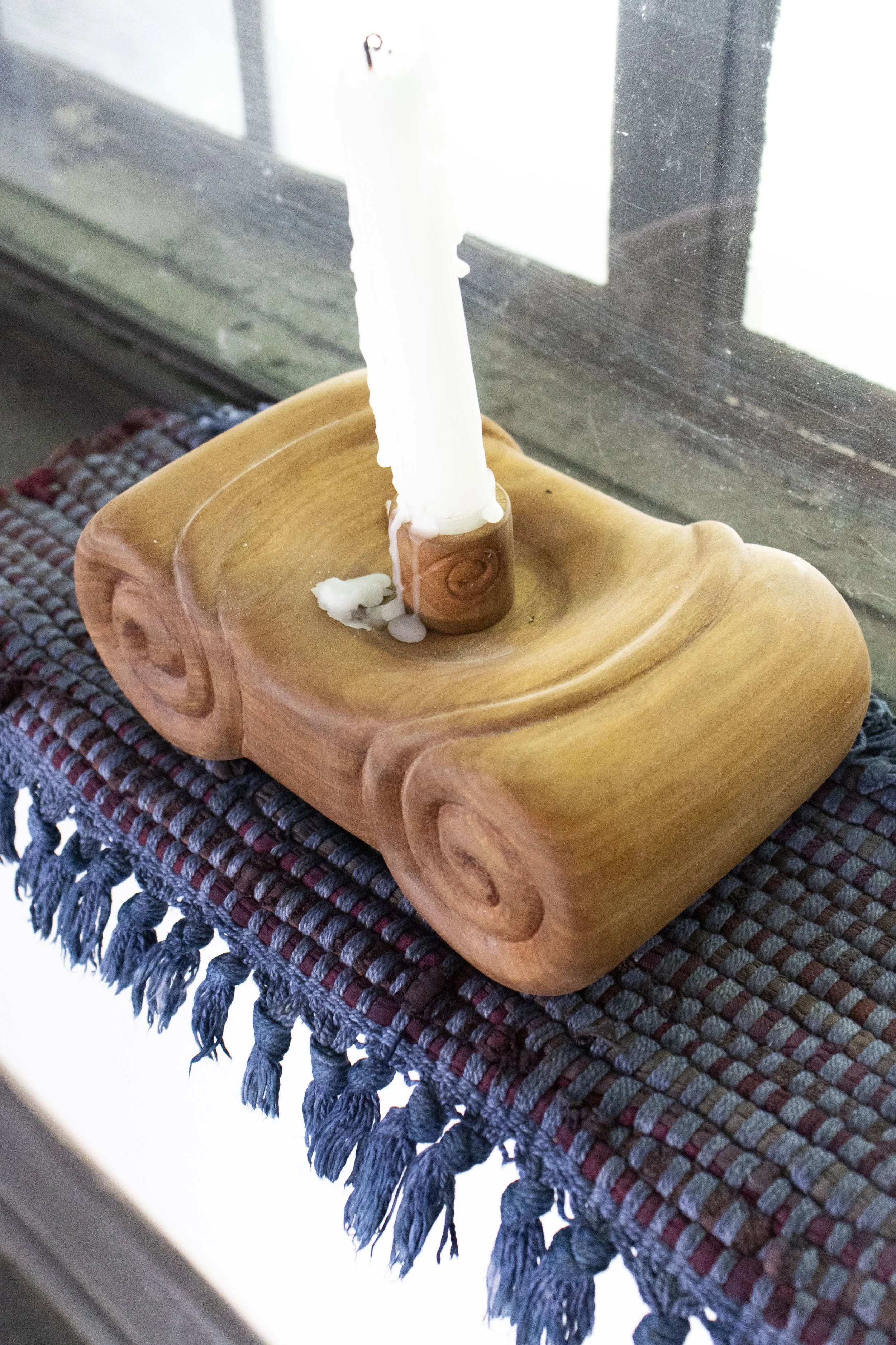  Light Source, 2025,   cherry, cotton rug, dye, candle,   15” x 6” x 14”  photo by Alissa Touranachun 