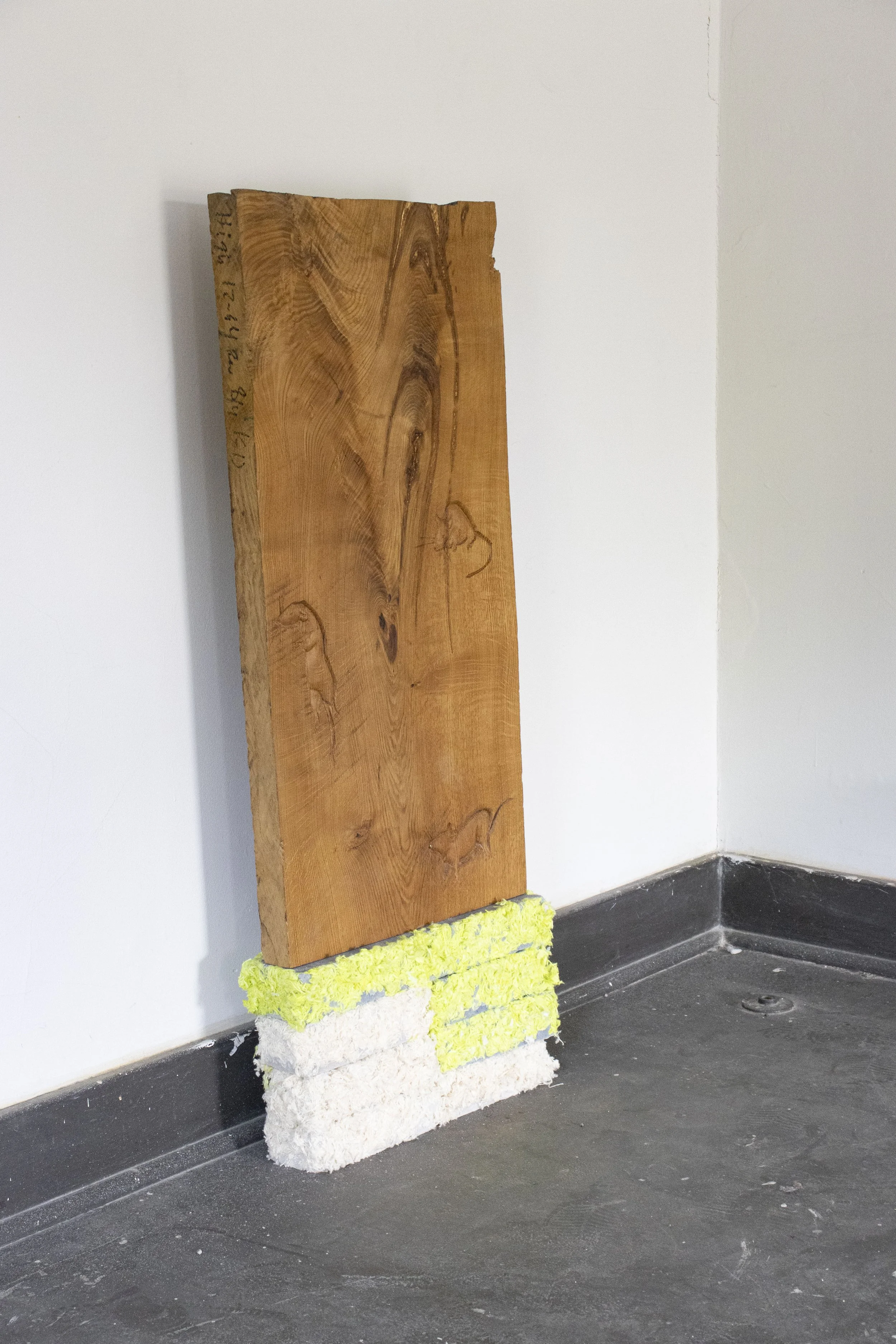  The Helpers, 2026,   oak, cotton, cast stone,   18” x 4” x 48”  photo by Alissa Touranachun 