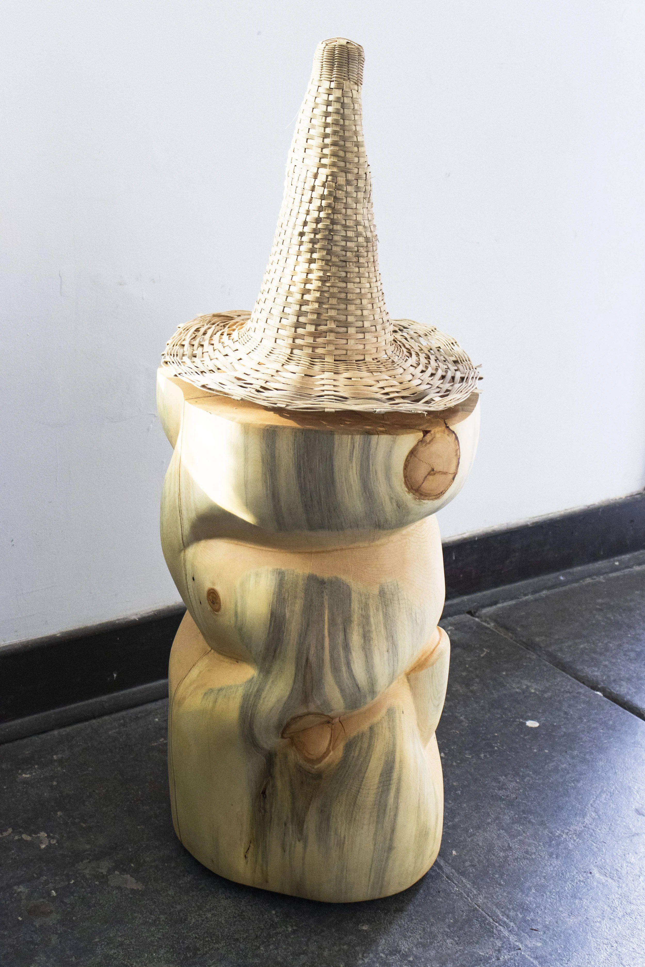  The Advisor, 2026,   wood, reed, tea stain,   44” x 16” x 16”  photo by Alissa Touranachun 
