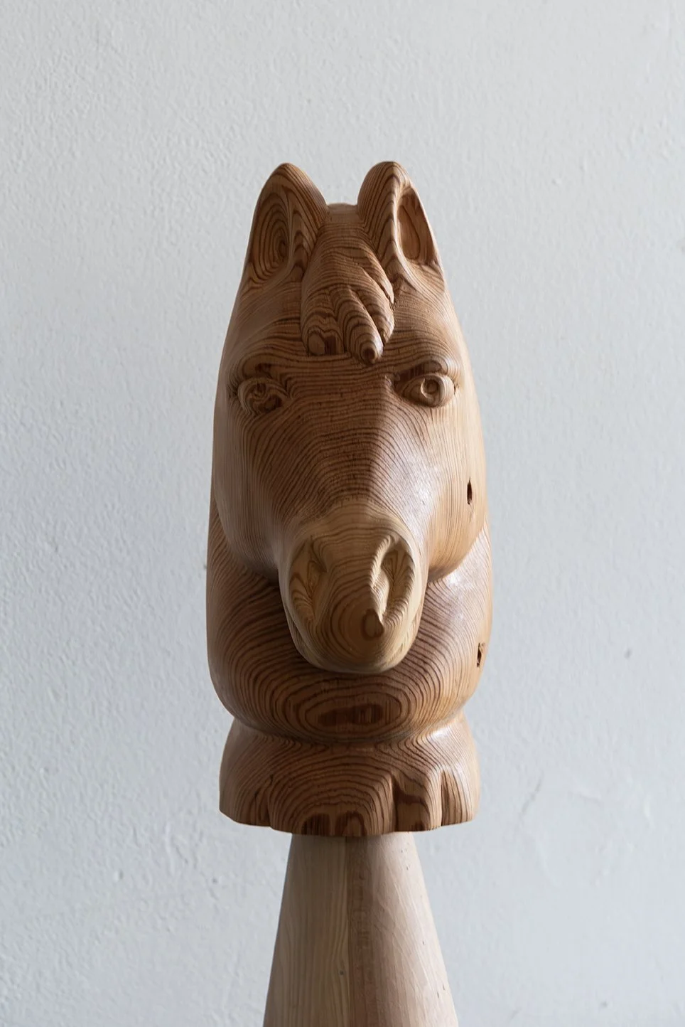  Guardian, 2026,   wood, colored pencil, leather,   28” x 17” x 28”  photo by Maria Burunderena 