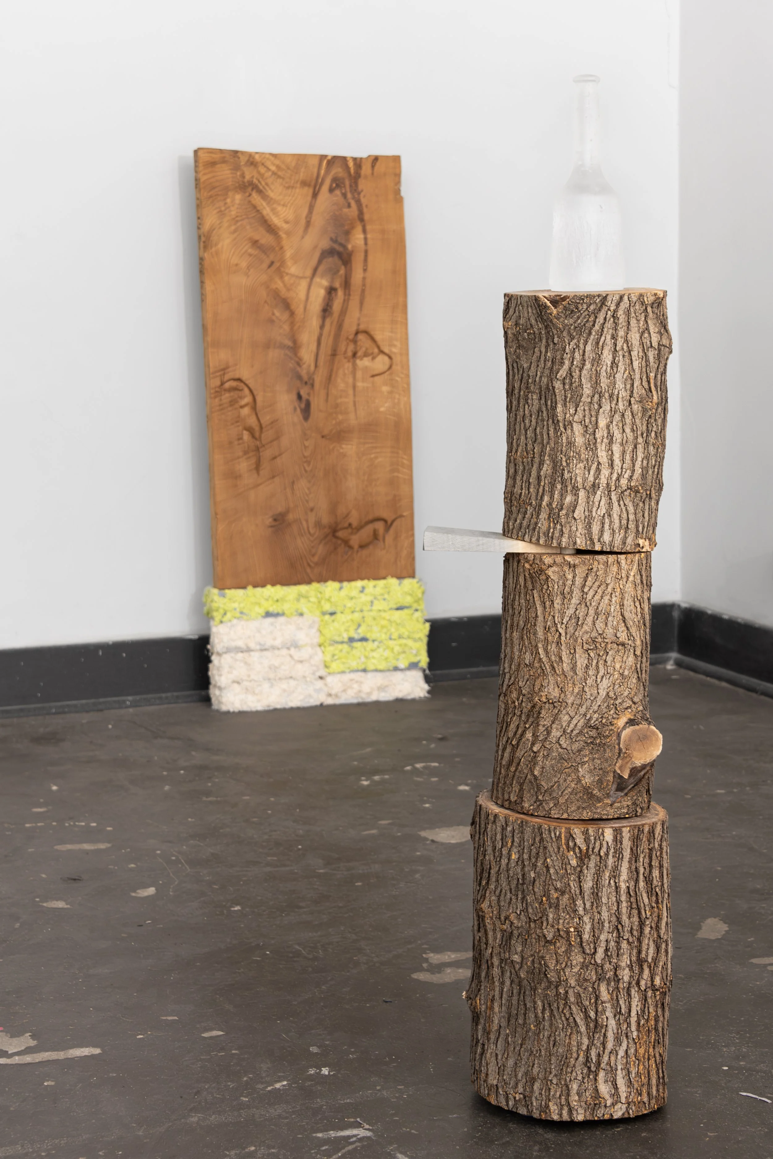  The Tool, 2026,   cast glass, wood,   11” x 10” x 49”  photo by Maria Burundarena 