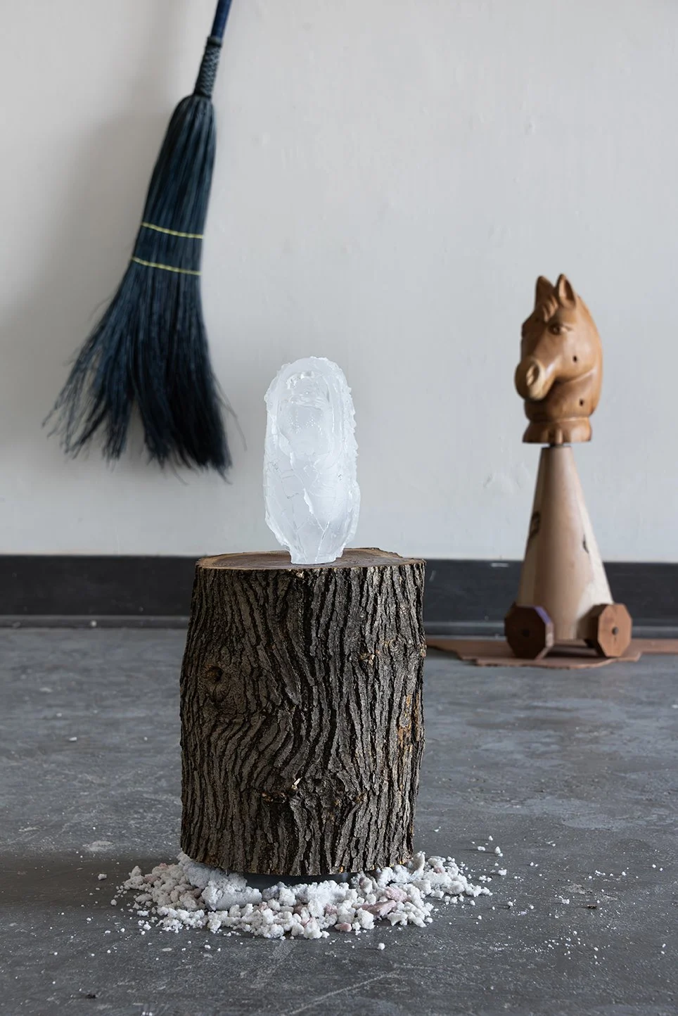  The Transformation, 2026,   cast glass, wood, cast stone,   15” x 15” x 22”  photo by Maria Burunderena 