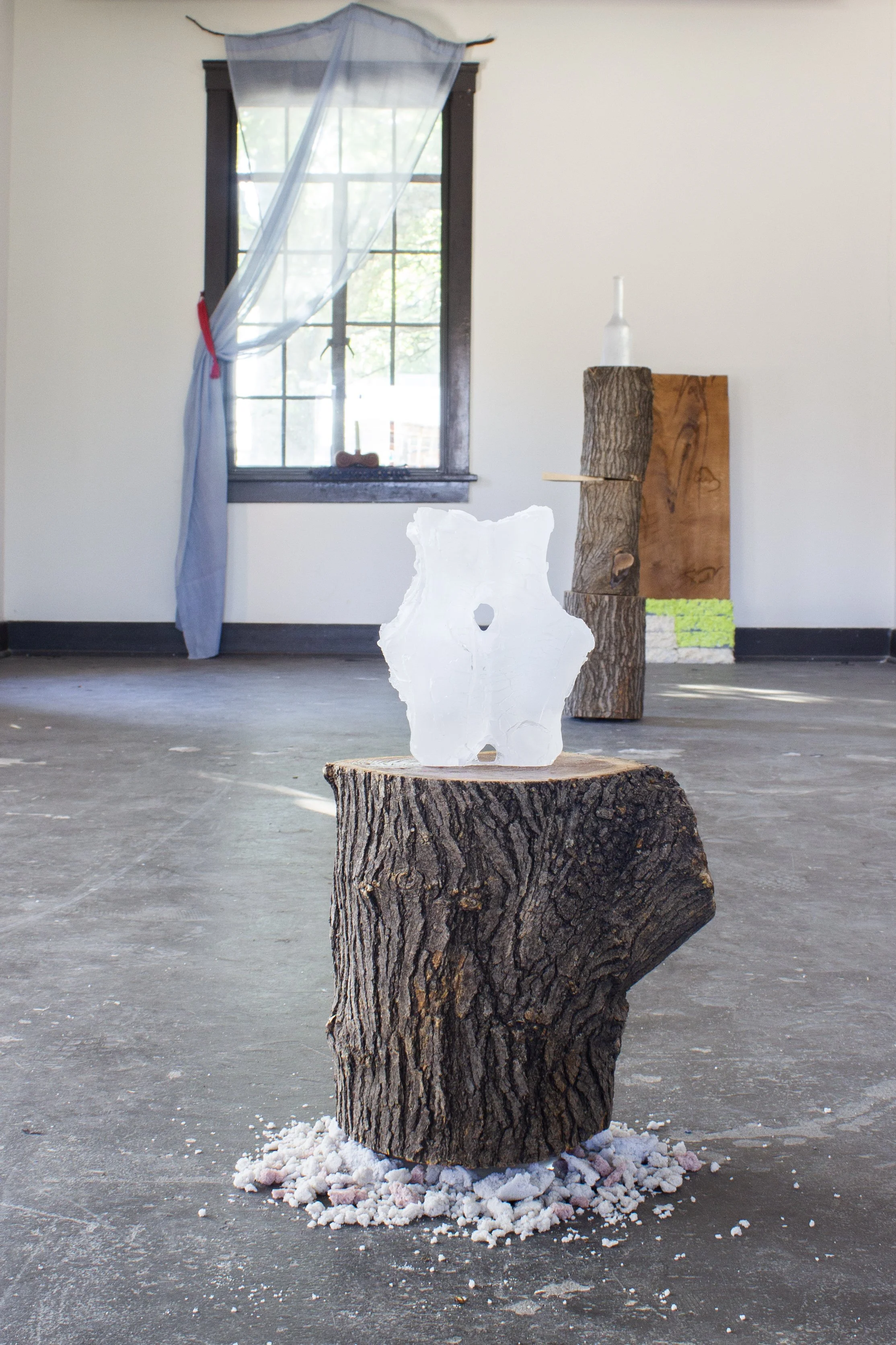  The Transformation, 2026,   cast glass, wood, cast stone,   15” x 15” x 22” 