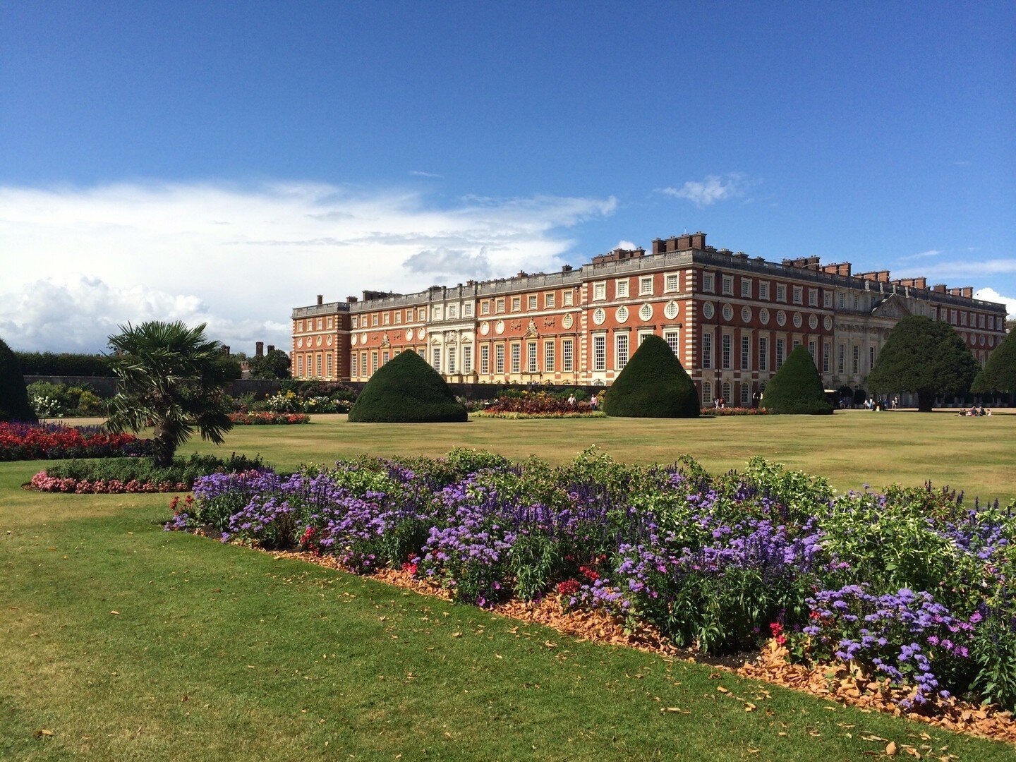 Hampton Court in summer looking like a set for Bridgerton.