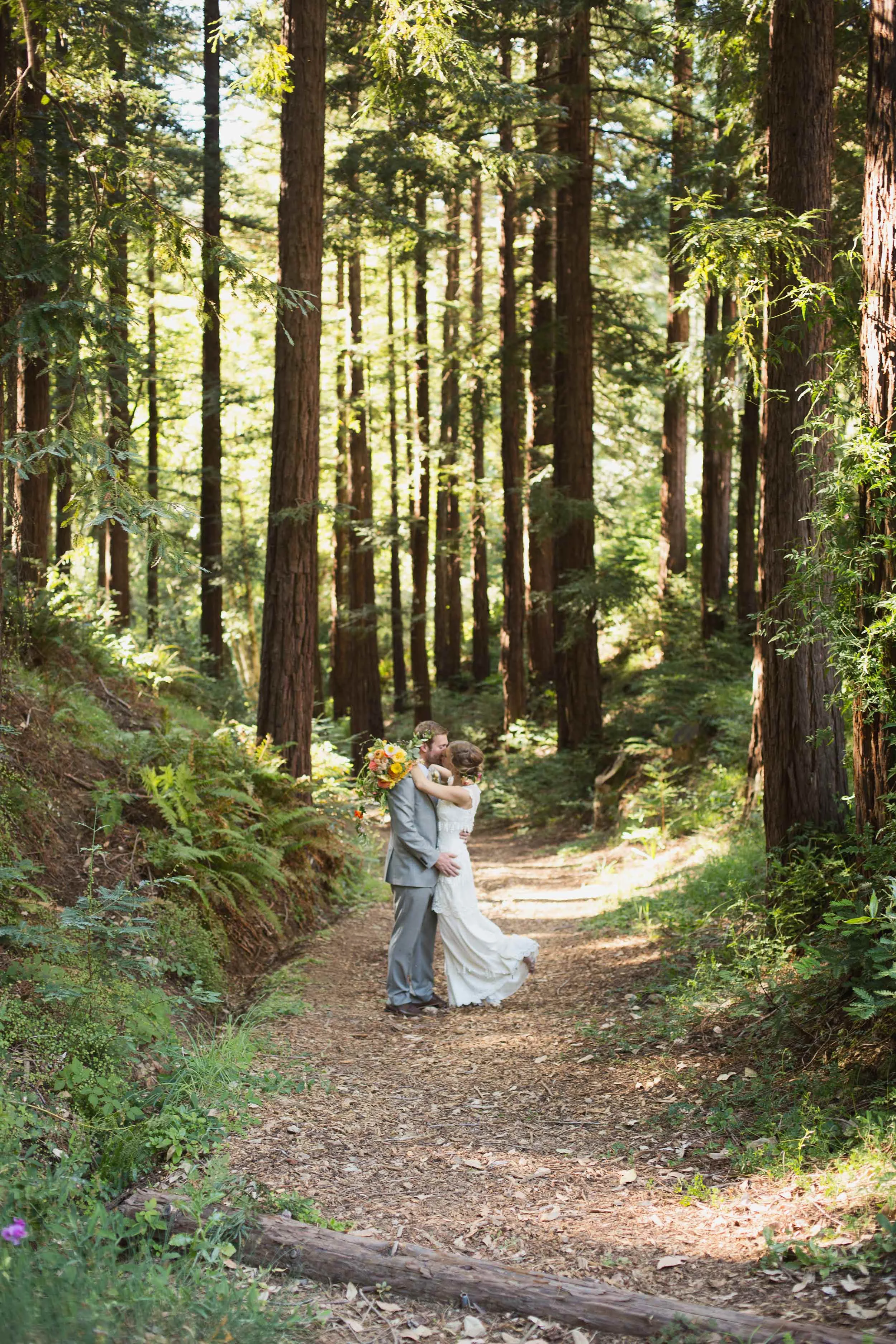 Bride and groom in redwood forest at Ralston White Retreat in Mill Valley