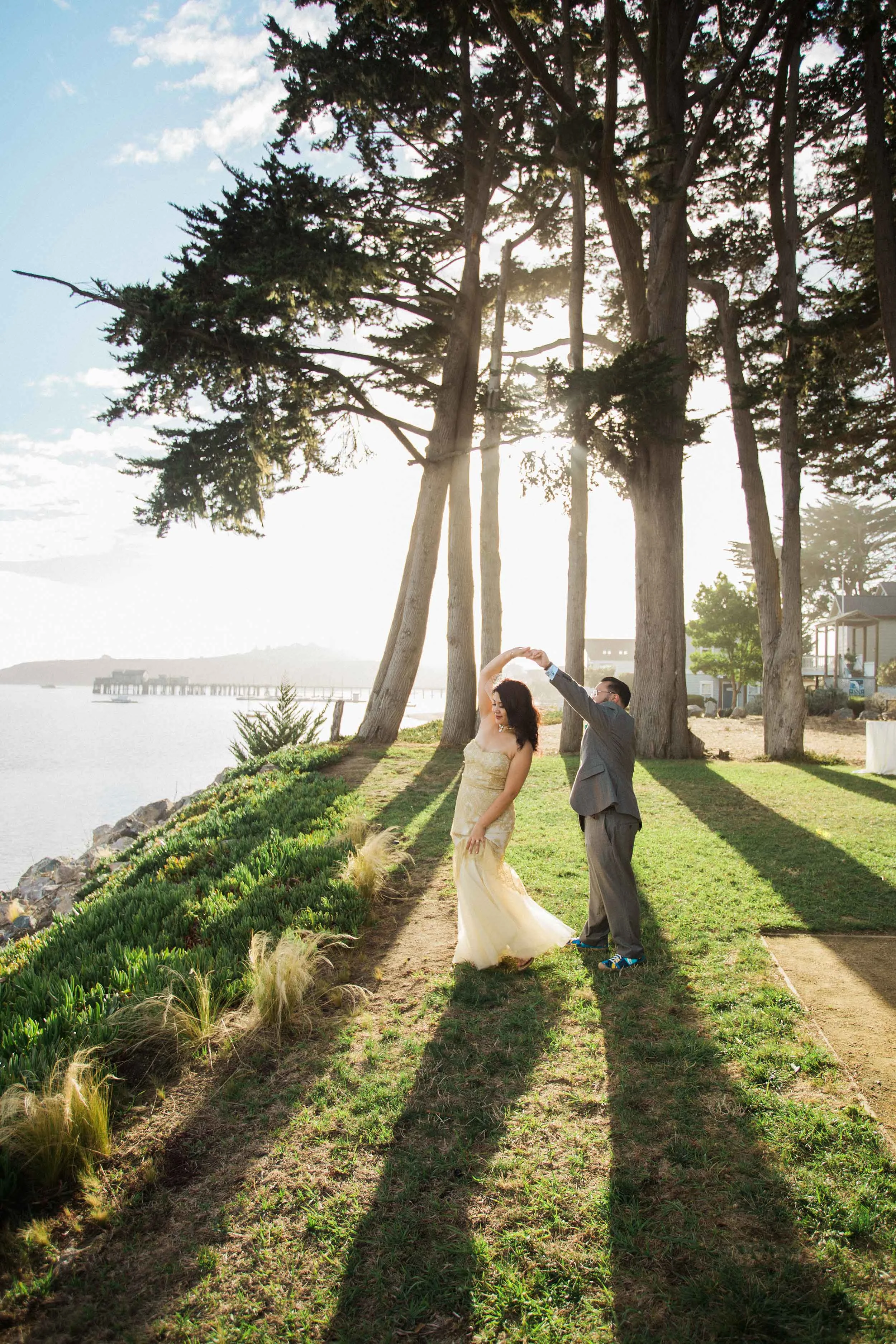 bride and groom on lawn dancing at Mavericks Event Center in Half Moon Bay